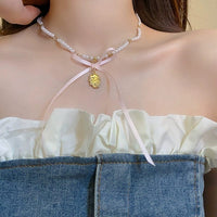 Thumbnail for Baroque Pink Ribbon Bowknot Relief Pendant Pearl Necklace - ArtGalleryZen