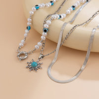 Thumbnail for Bohemia Turquoise Inlaid Sun Pendant Evil Eye Pearl Chain Necklace Set - ArtGalleryZen