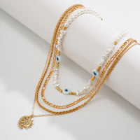 Thumbnail for Boho Layered CZ Inlaid Sun Moon Pendant Evil Eye Pearl Chain Necklace Set - ArtGalleryZen