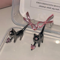 Thumbnail for Chic Pink Crystal Heart Dangling Ribbon Cat Earrings - ArtGalleryZen