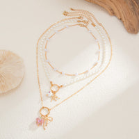 Thumbnail for Elegant 3pcs Bow Starfish Flower Ceramic Pendant Pearl Chain Necklace Set - ArtGalleryZen