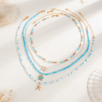Thumbnail for Elegant 4pcs Enamel Butterfly Flower Starfish Pendant Seed Beaded Necklace Set - ArtGalleryZen