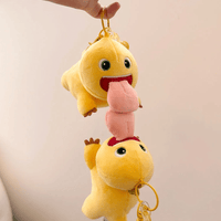 Thumbnail for A plush keychain depicting a yellow dragon with a big tongue, hanging by a metal ring.