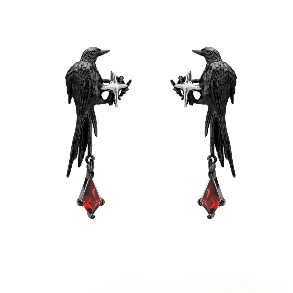 A close-up image of a person's ear wearing a Gothic style ear cuff with a dangle crow design and red rhinestone details.
